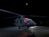 A UH-60 Black Hawk Helicopter Parked on the Flight Line under a Full Moon Lámina fotográfica A UH-60 Black Hawk Helicopter Parked on the Flight Line under a Full Moon Lámina fotográfica