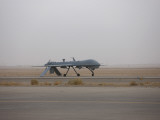 A Mq-1C Warrior Taxis Out to the Runway to for a Mission over Northern Iraq Photographic Print