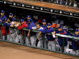 Texas Rangers v San Francisco Giants, Game 1: The Texas Rangers look on from the dugout Photographic Print by Christian Petersen