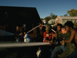 Young Men Battle a Fire in a Burning Urban House in Kansas City, Mo Photographie par Ted Spiegel