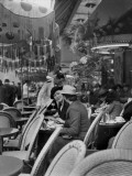 Women Relaxing at a Sidewalk Cafe Photographic Print by Maynard Owen Williams