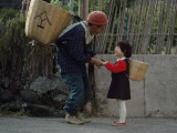 For Fun, a Girl Carries a Copy of Her Grandmother's Harvest Basket Photographic Print by Karen Kasmauski