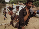 Stopping Along Itaquai River the Men Hunt for Dinner Photographic Print by Nicolas Reynard