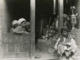 Afghan Men Relaxing at a Bazaar Photographie par Maynard Owen Williams
