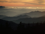 Sunset Casts a Colorful Glow over Mountaintops Shrouded in Fog Fotoprint van James P. Blair Sunset Casts a Colorful Glow over Mountaintops Shrouded in Fog Fotoprint van James P. Blair