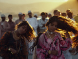 Dancers Swing their Hair at a Festival in Muscat Photographie par Thomas J. Abercrombie