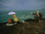 A Tourist Approaches China's Southernmost Point Photographic Print by Michael S. Yamashita