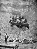 A Group of Miners Rides the Cable Car Back and Forth from Work Photographic Print by Gardiner F. Williams