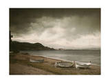 As a Storm Approaches, Empty Rowboats Lay on the Shore Photographie par Maynard Owen Williams