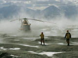 Volcanology Team Await a Helicopter in the Gorely Volcano Crater Photographie par Carsten Peter