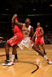 Houston Rockets v Toronto Raptors: Amir Johnson and Jordan Hill Photographic Print by Ron Turenne