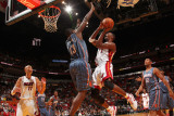 Charlotte Bobcats v Miami Heat: Chris Bosh and Nazr Mohammed Photographic Print by Victor Baldizon