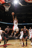 Chicago Bulls v Toronto Raptors: Luol Deng, DeMar DeRozan and Taj Gibson Photographie par Ron Turenne