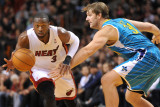 New Orleans Hornets v Miami Heat: Dwyane Wade and Aaron Gray Photographic Print by James Riley
