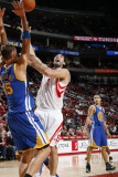 Golden State Warriors v Houston Rockets: Luis Scola and Andris Biedrins Photographic Print by Bill Baptist