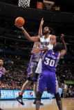 Phoenix Suns v Denver Nuggets: Nene and Earl Barron Photographic Print by Garrett Ellwood