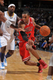 Chicago Bulls v Denver Nuggets: C.J. Watson and Ty Lawson Photographic Print by Garrett Ellwood