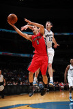 Toronto Raptors v Washington Wizards: Jose Calderon and Kirk Hinrich Photographic Print by Ned Dishman