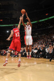 Philadelphia 76ers v Toronto Raptors: DeMar DeRozan and Evan Turner Photographic Print by Ron Turenne