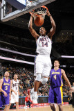 Los Angeles Lakers v New Jersey Nets: Derrick Favors and Luke Walton Photographic Print by Andrew Bernstein