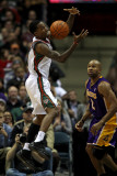 Los Angeles Lakers v Milwaukee Bucks: Brandon Jennings and Derek Fisher Photographic Print by Jonathan Daniel