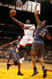 Charlotte Bobcats v Miami Heat: Dwyane Wade and Boris Diaw Photographic Print by Issac Baldizon