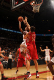 Houston Rockets v Toronto Raptors: DeMar DeRozan and Brad Miller Photographic Print by Ron Turenne