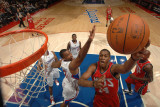New Jersey Nets v Los Angeles Clippers: Derrick Favors and Jarron Collins Photographic Print by Noah Graham