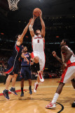 Atlanta Hawks v Toronto Raptors: Linas Kleiza and Zaza Pachulia Photographic Print by Ron Turenne
