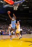 Denver Nuggets v Golden State Warriors: Ty Lawson and Dan Gadzuric Photographic Print by Rocky Widner
