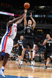 Detroit Pistons v Minnesota Timberwolves: Luke Ridnour and Jason Maxiell Photographic Print by David Sherman