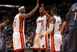 Charlotte Bobcats v Miami Heat: LeBron James, Chris Bosh and Dwyane Wade Photographic Print by Andrew Bernstein