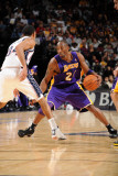 Los Angeles Lakers v New Jersey Nets: Kobe Bryant and Devin Harris Photographic Print by Andrew Bernstein