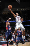 Atlanta Hawks v New Jersey Nets: Devin Harris and Mike Bibby Photographic Print by Jesse D. Garrabrant