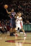 Atlanta Hawks v Toronto Raptors: Joe Johnson and Jerryd Bayless Photographic Print by Ron Turenne