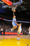Denver Nuggets v Golden State Warriors: Chris Anderson and Stephen Curry Photographic Print by Rocky Widner
