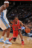 Chicago Bulls v Denver Nuggets: C.J. Watson and Al Harrington Photographic Print by Garrett Ellwood
