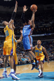 Oklahoma City Thunder v New Orleans Hornets: Russell Westbrook and David West Photographic Print by Layne Murdoch
