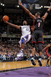 Miami Heat v Sacramento Kings: Tyreke Evans and Chris Bosh Photographic Print by Rocky Widner