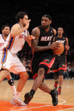 Miami Heat v New York Knicks: LeBron James and Danilo Gallinari Photographic Print by Al Bello