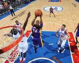Los Angeles Lakers v Philadelphia 76ers: Kobe Bryant and Jrue Holiday Photographic Print by Jesse D. Garrabrant