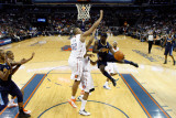 Denver Nuggets v Charlotte Bobcats: Ty Lawson and Boris Diaw Photographic Print by Streeter 