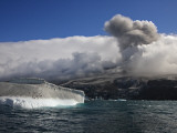 Ash Plume from Mt Belinda Coats an Iceberg Occupied by Penguins Photographic Print by Maria Stenzel