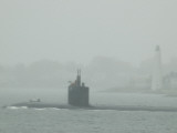A Submarine Passes New London Harbor Light in the Fog Photographie par Todd Gipstein