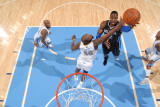 Orlando Magic v Denver Nuggets: Dwight Howard and Melvin Ely Photographic Print by Garrett Ellwood