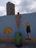 A Boy Peeking over Wall of a Hotel Swimming Pool in Monaco Photographic Print by Jodi Cobb