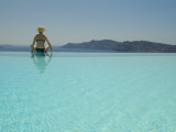 A Woman at an Infinity Pool Overlooking the Aegean Sea Photographic Print by Richard Nowitz