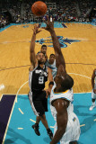 San Antonio Spurs v New Orleans Hornets: Tony Parker and Emeka Okafor Photographic Print by Chris Graythen