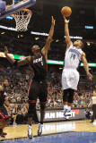 Miami Heat v Orlando Magic: Jameer Nelson and Chris Bosh Photographic Print by Mike Ehrmann
