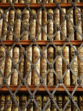 Close Up View of Antique Books Behind Caged Shelves Photographic Print by Jim Richardson
